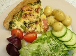 Vegetarian Mediterranean Quiche (peppers, courgettes, tomatoes) with new potatoes and salad